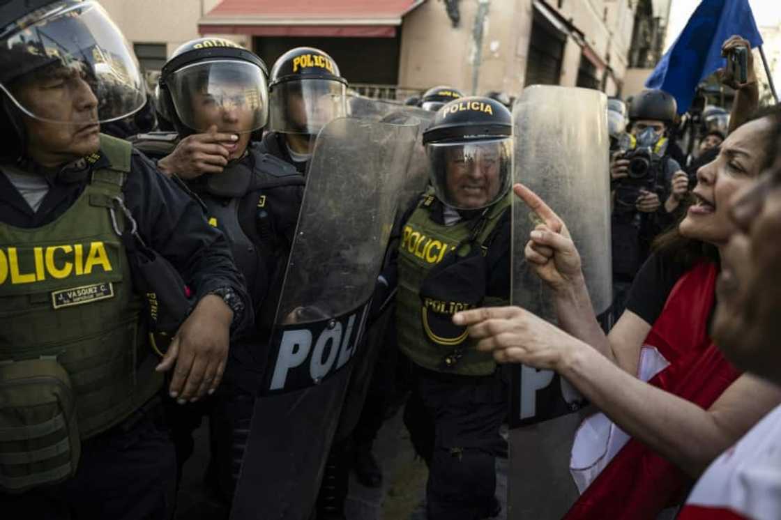 Opponents of Peruvian President Pedro Castillo face off with police during a demonstration in Lima on November 5, 2022 Opponents of Peruvian President Pedro Castillo face off with police during a demonstration in Lima on November 5, 2022