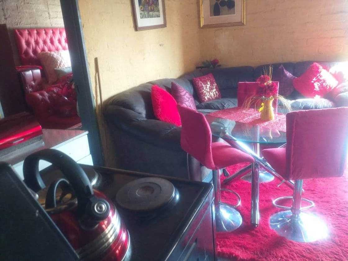 Woman showcases photos of her lush RDP house. Woman showcases photos of her lush RDP house.