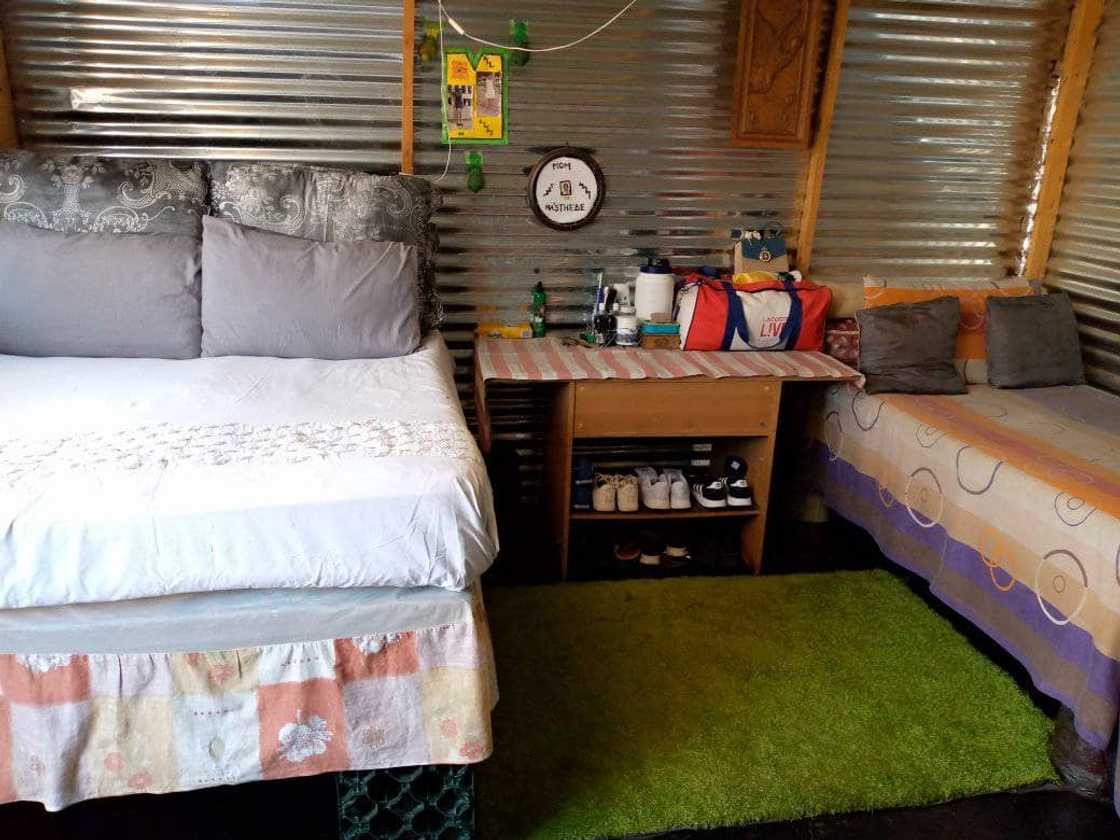 Young lady shows off the bedroom space. Young lady shows off the bedroom space.