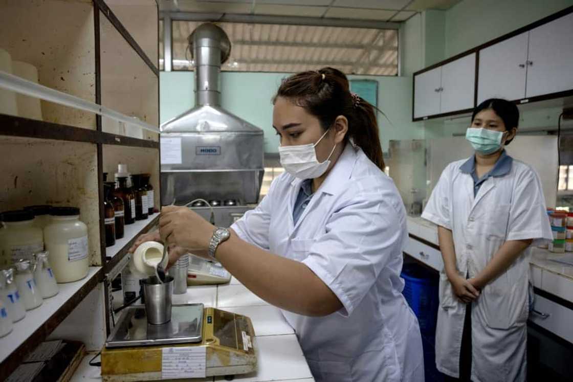 Lab technicians check the quality of latex at the VA Latex rubber factory in Trang province Lab technicians check the quality of latex at the VA Latex rubber factory in Trang province