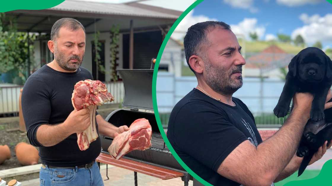 Georgy Kavkaz holds raw cuts of meat and he pets a black pup