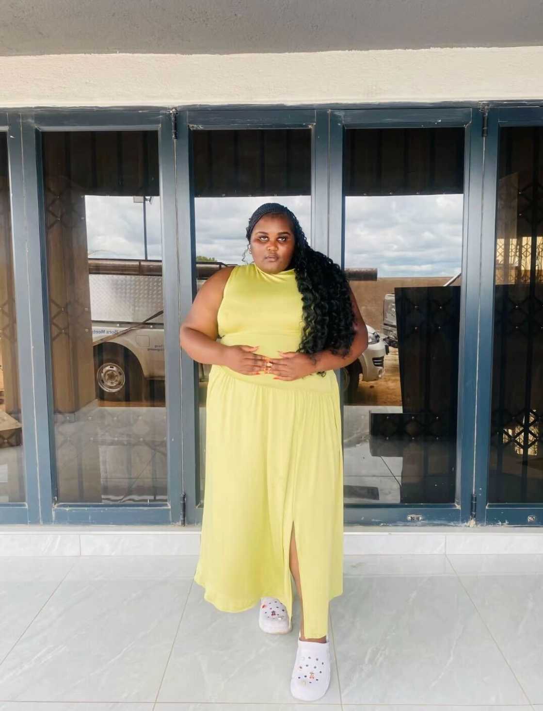 A woman in South Africa rocked a yellow dress and posed in a TikTok video. A woman in South Africa rocked a yellow dress and posed in a TikTok video.