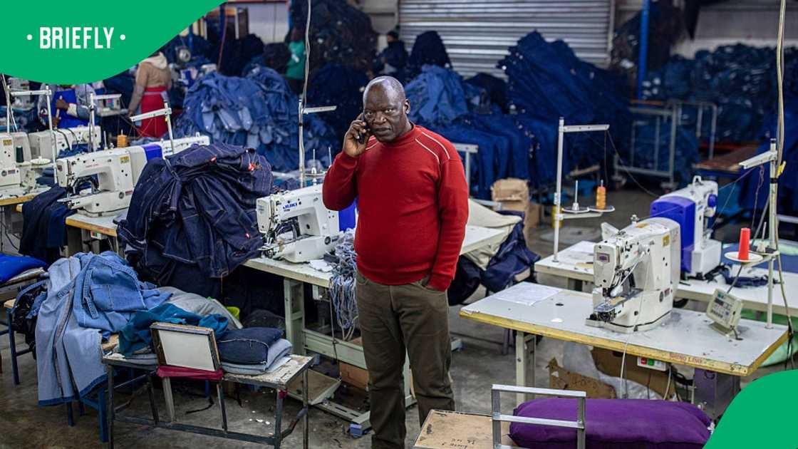 The founder and managing director of denim products company Afri-Expo, Teboho Kobeli, stands on factory floor on July 4, 2025 in Maseru, Lesotho