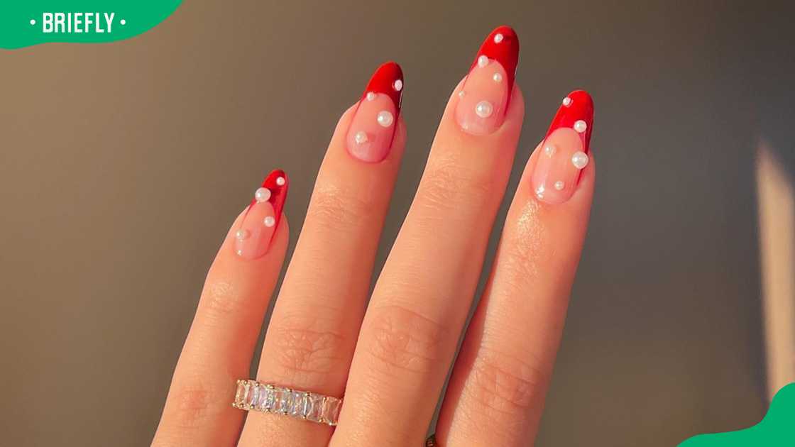 Red Frenchie and pearl nail design