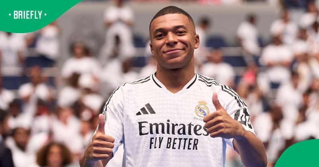 Kylian Mbappé wearing his Real Madrid jersey at Santiago Bernabeu Stadium during his official unveiling as the club’s newest addition.