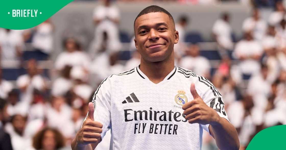 Kylian Mbappé wearing his Real Madrid jersey at Santiago Bernabeu Stadium during his official unveiling as the club’s newest addition. Kylian Mbappé wearing his Real Madrid jersey at Santiago Bernabeu Stadium during his official unveiling as the club’s newest addition.