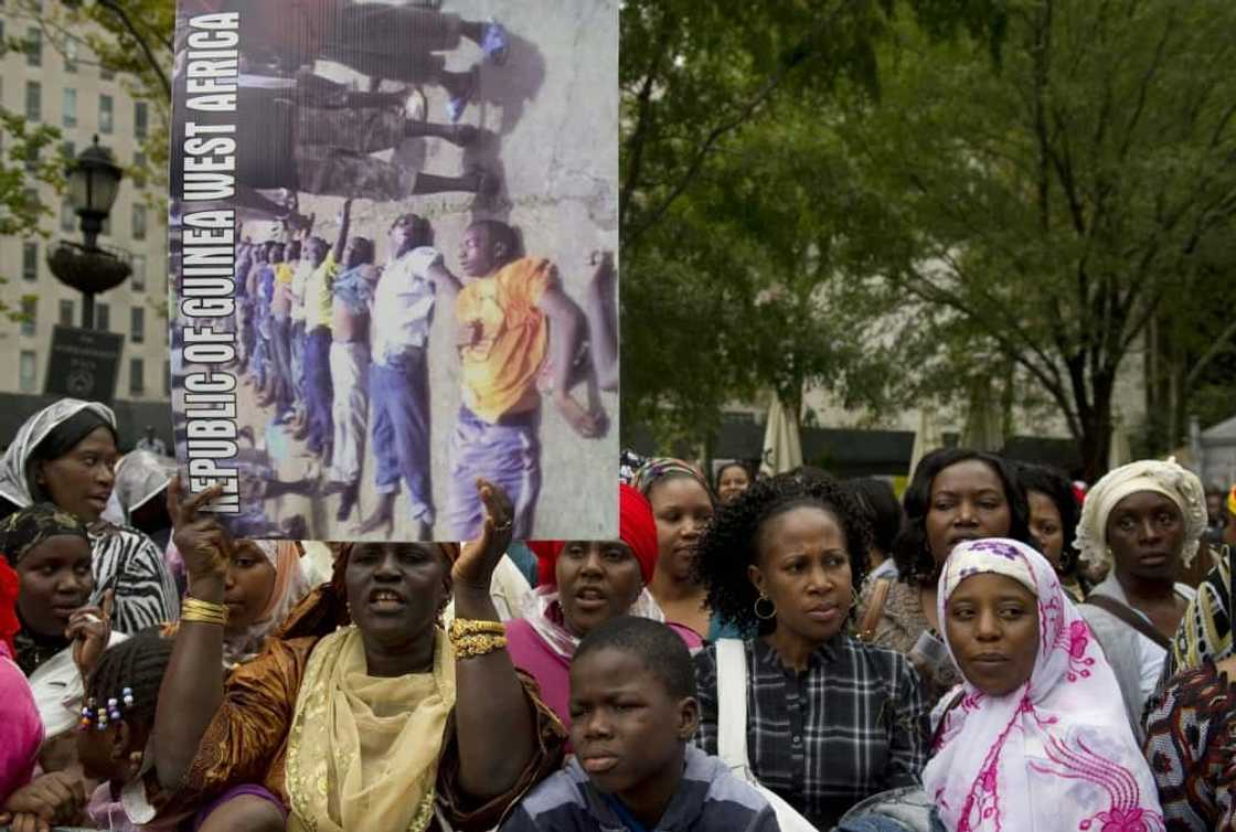 At least 157 people were murdered and 109 women raped in the 2009 massacre At least 157 people were murdered and 109 women raped in the 2009 massacre