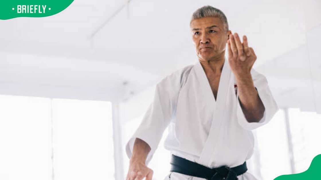 Japanese karate master showing a deadliest fighting style Japanese karate master showing a deadliest fighting style