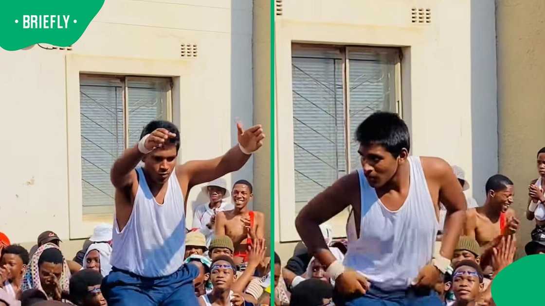 A man did a Zulu dance in the middle of a huge crowd.