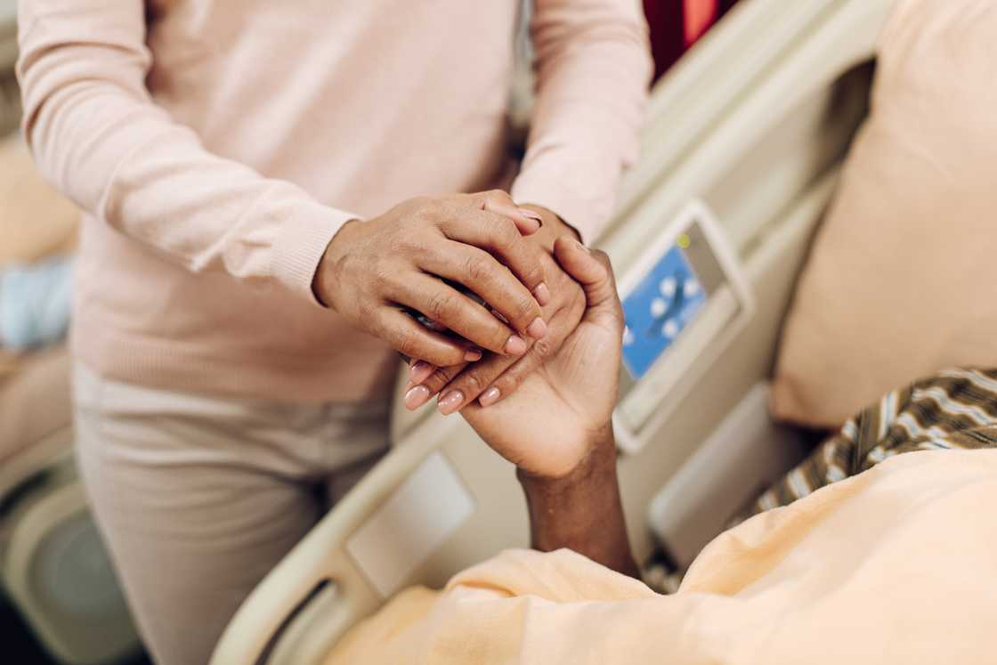 A lady visits her husband in hospital