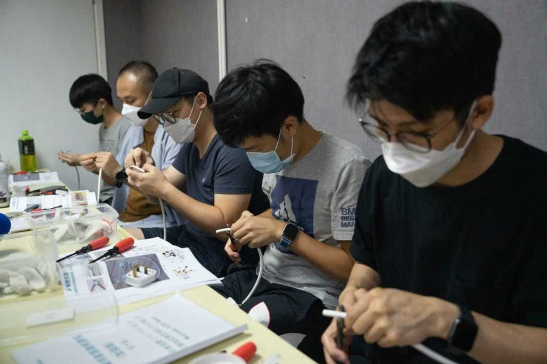 Despite their optimism for life overseas, many would-be emigrants said they were worried about job prospects and wanted to learn more skills as insurance -- these students study basic wiring skills Despite their optimism for life overseas, many would-be emigrants said they were worried about job prospects and wanted to learn more skills as insurance -- these students study basic wiring skills