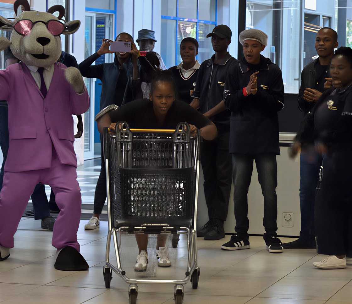 A woman, thought to be a mom, amazed South Africans with her performance in the trolley dash. A woman, thought to be a mom, amazed South Africans with her performance in the trolley dash.