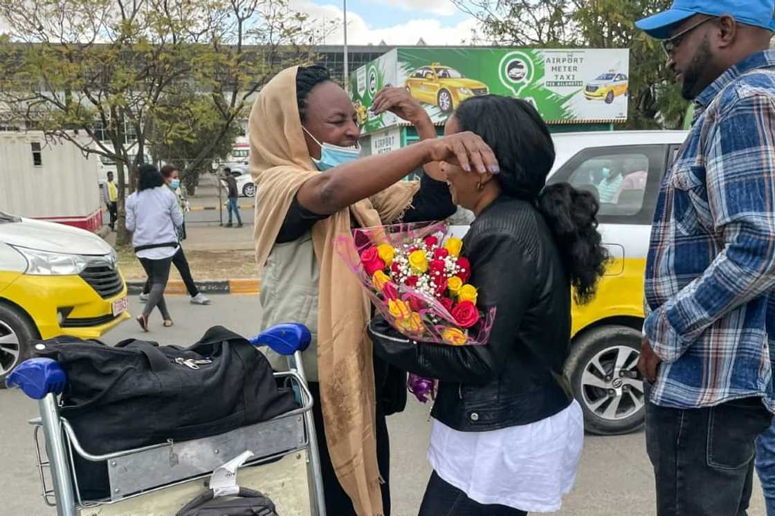 Passengers arriving from Mekele were greeted by relatives with long embraces, flowers and tears