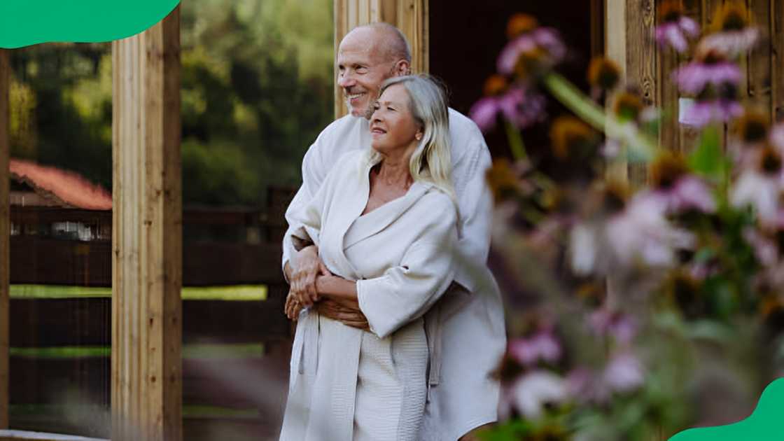 A couple wearing white robes.