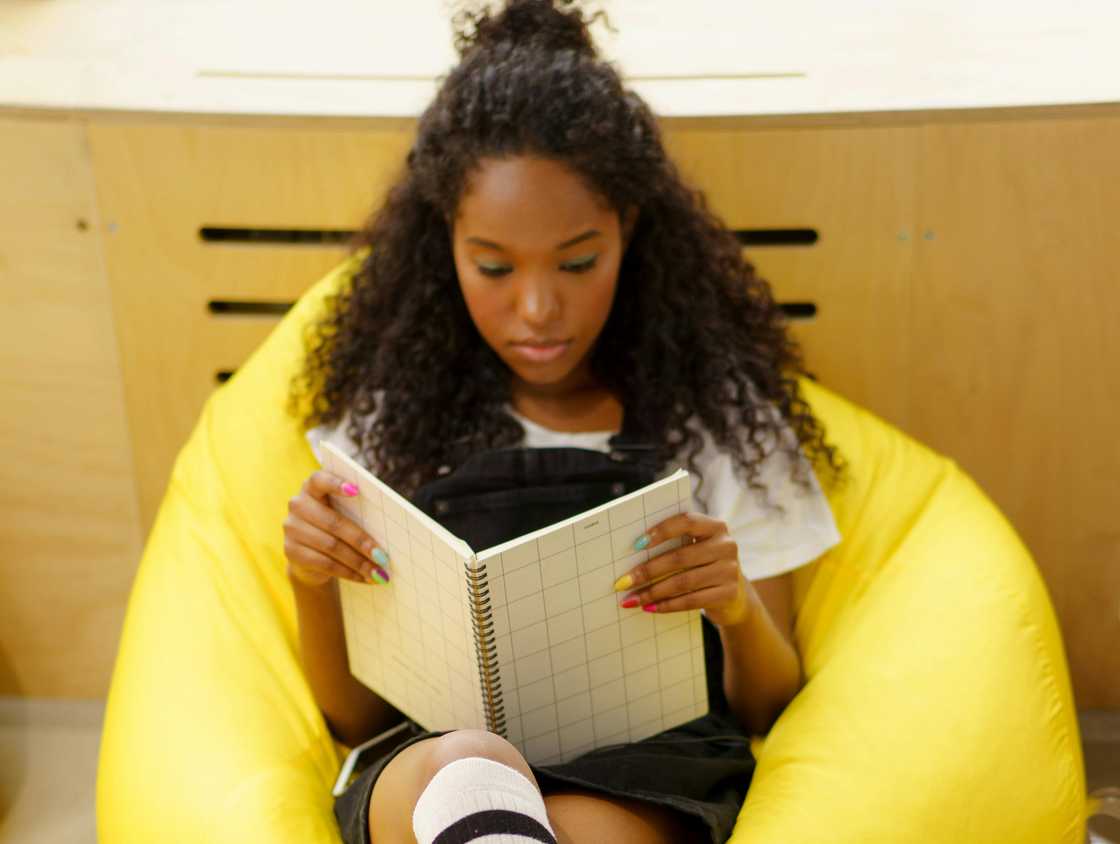 A girl reading a journal