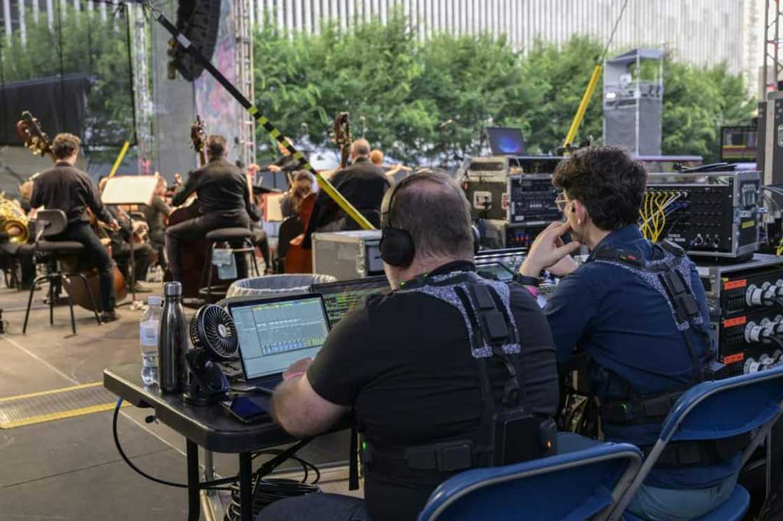 Technicians control haptic suits that deliver 24 points of vibration, translating the music played onstage to the wearer Technicians control haptic suits that deliver 24 points of vibration, translating the music played onstage to the wearer