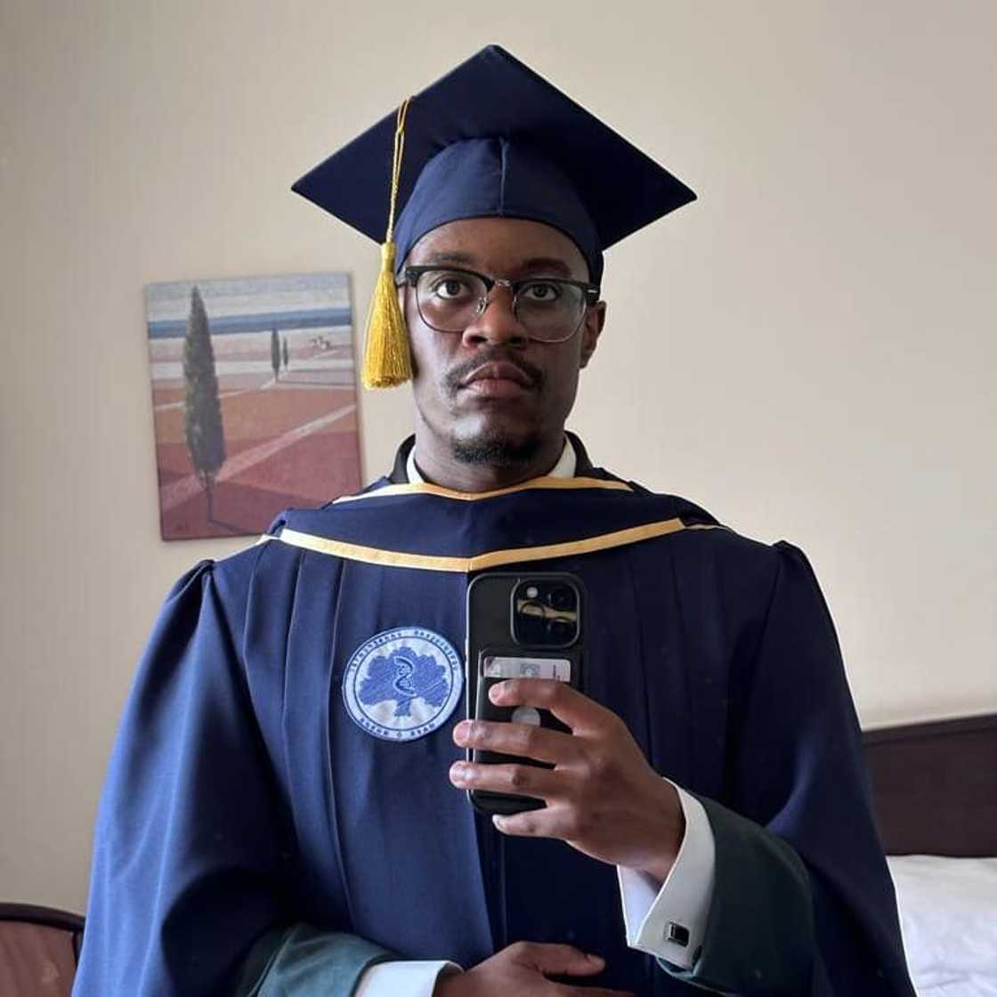 A man graduated with two degrees from a Russian university