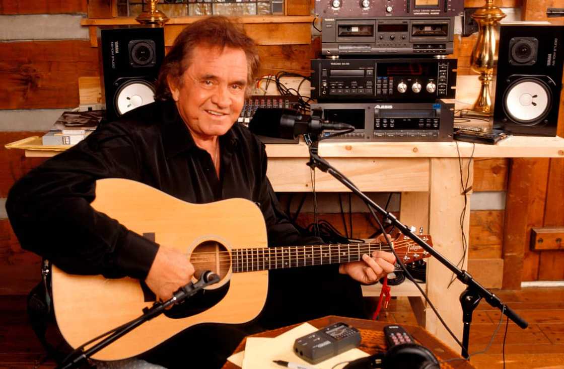 Country singer Johnny Cash at a home recording studio Country singer Johnny Cash at a home recording studio