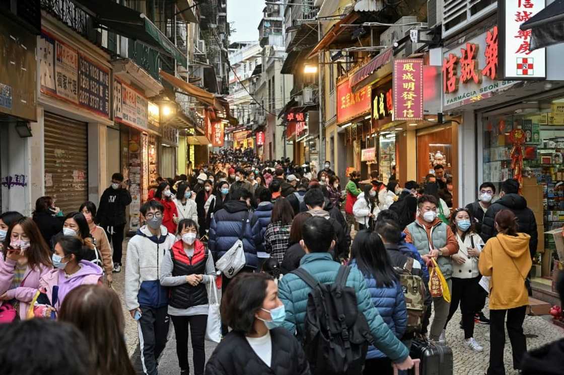 Mainland Chinese tourists filled Macau's streets, and stores selling local snacks like almond cookies and meat jerky had trouble keeping up