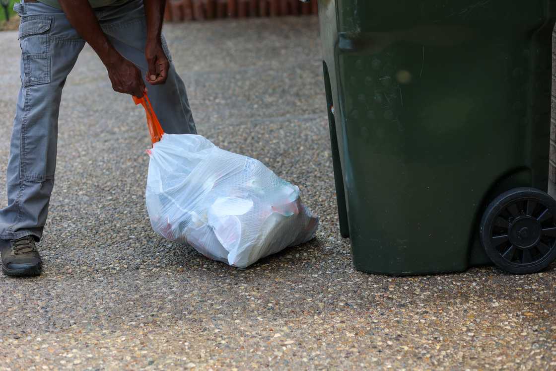 A man takes out trash