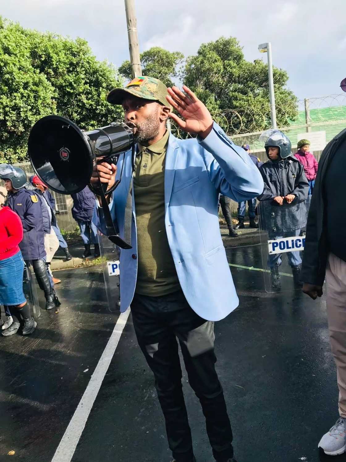 Gcobani Ndzongana addressed community members who marched to the Gaansbaai Police Station