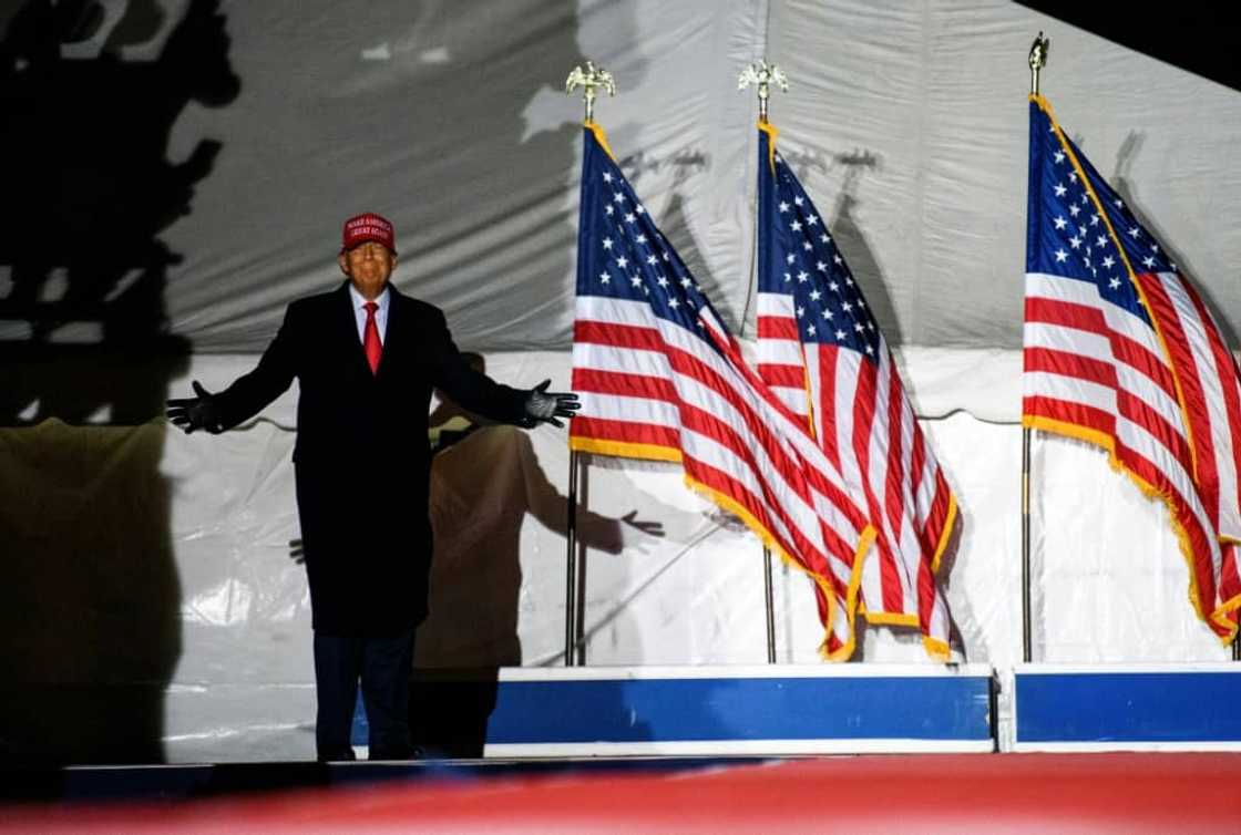 Former US president Donald Trump arrives during a campaign event at Sioux Gateway Airport on November 3, 2022 in Sioux City, Iowa