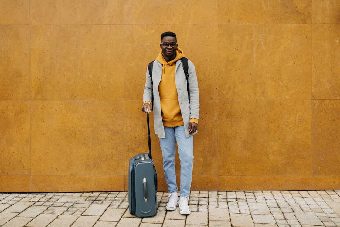 A student with a suitcase A student with a suitcase