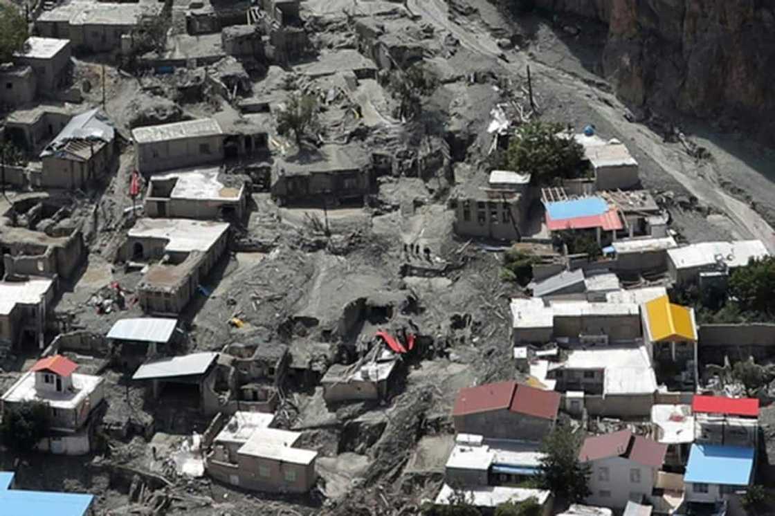 Houses surrounded by mud deposits at the site of a flash flood east of Tehran in the Firouzkouh area, where a landslide killed 14 people Houses surrounded by mud deposits at the site of a flash flood east of Tehran in the Firouzkouh area, where a landslide killed 14 people