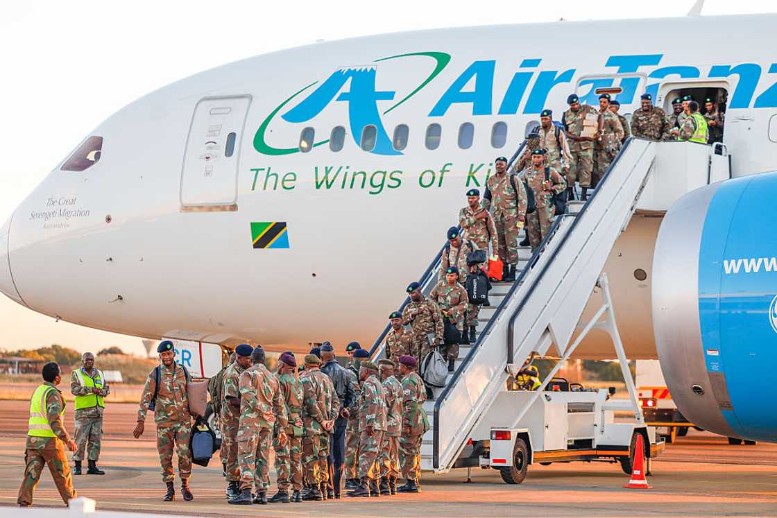 SANDF members returned from the DRC through Tanzania SANDF members returned from the DRC through Tanzania