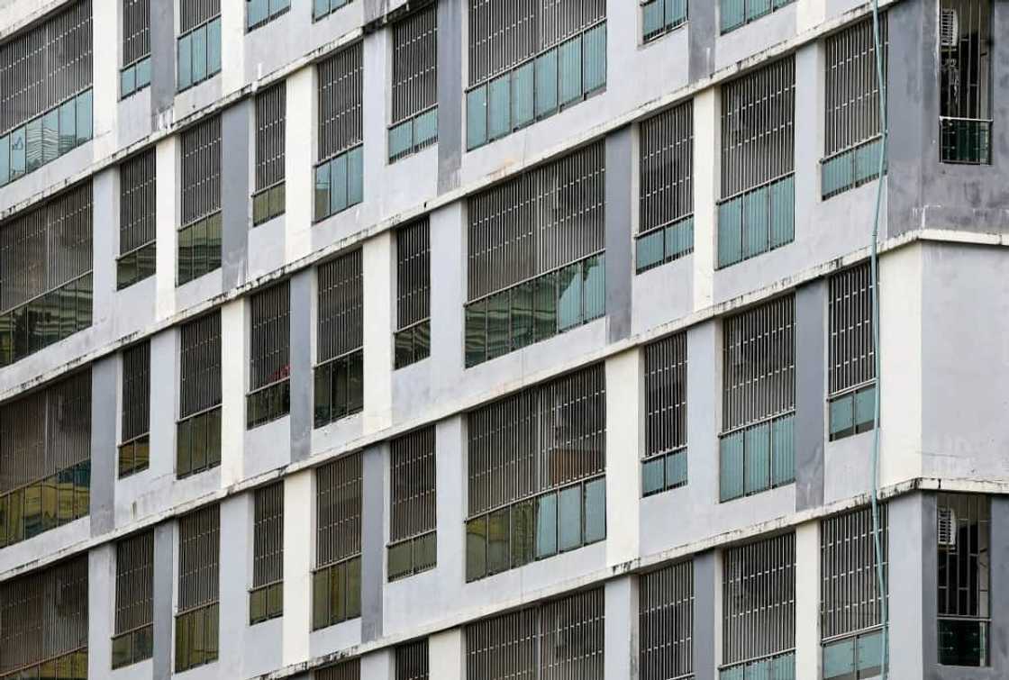 Steel bars cover the windows of empty buildings inside the Chinatown district in Sihanoukville in Preah Sihanouk province Steel bars cover the windows of empty buildings inside the Chinatown district in Sihanoukville in Preah Sihanouk province