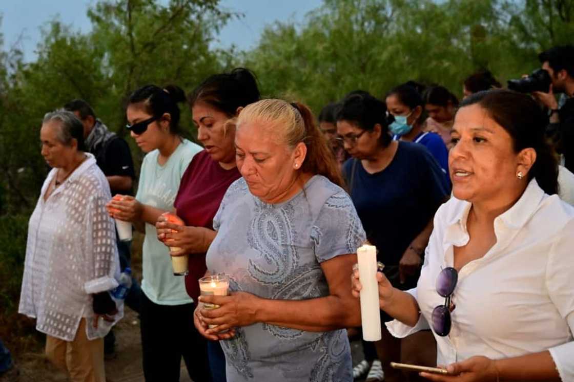 Friends and relatives hold a candlelit vigil for the trapped miners Friends and relatives hold a candlelit vigil for the trapped miners
