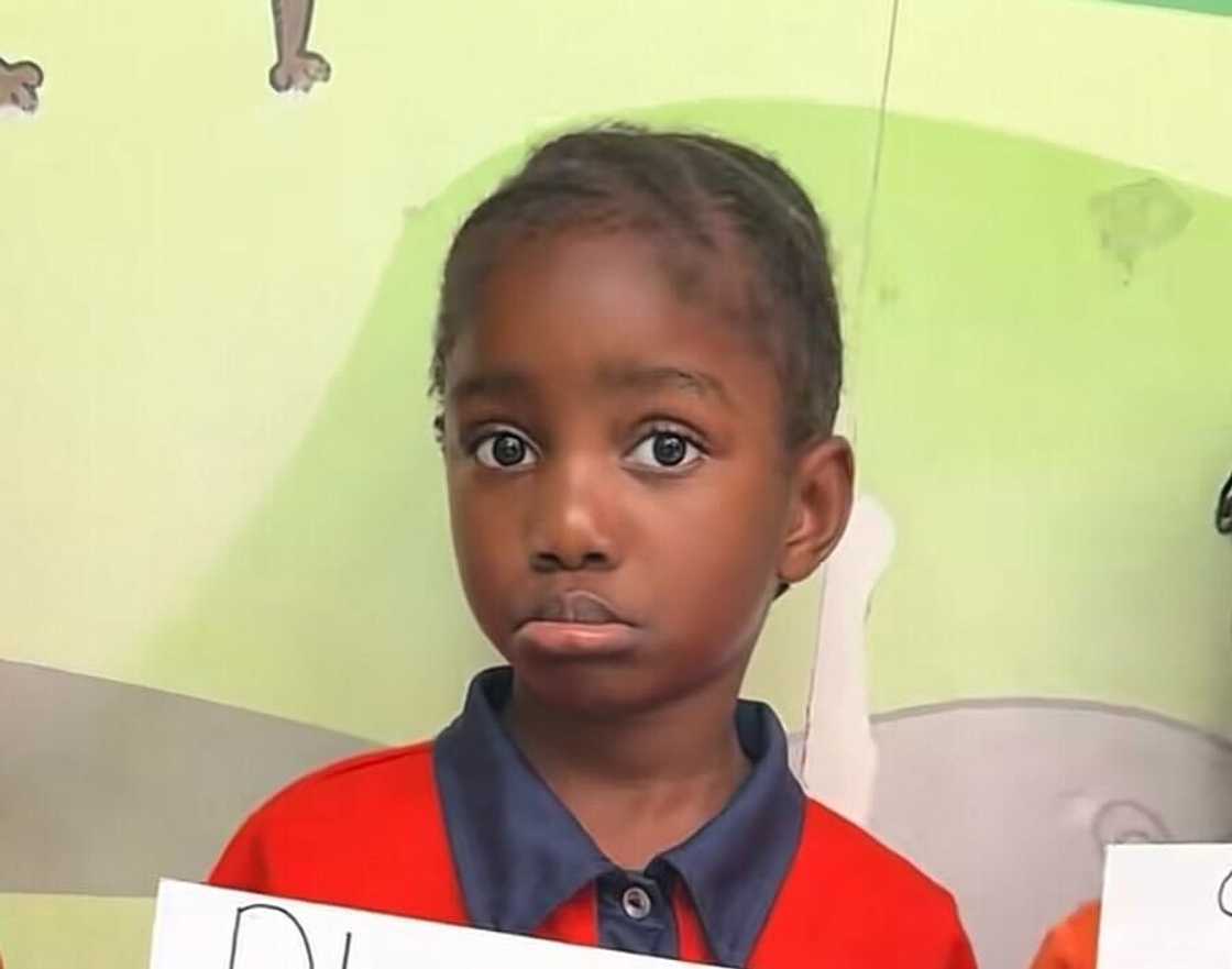 A little pupil held up a poster with a message to scholar transport after the Vanderbijpark tragedy.