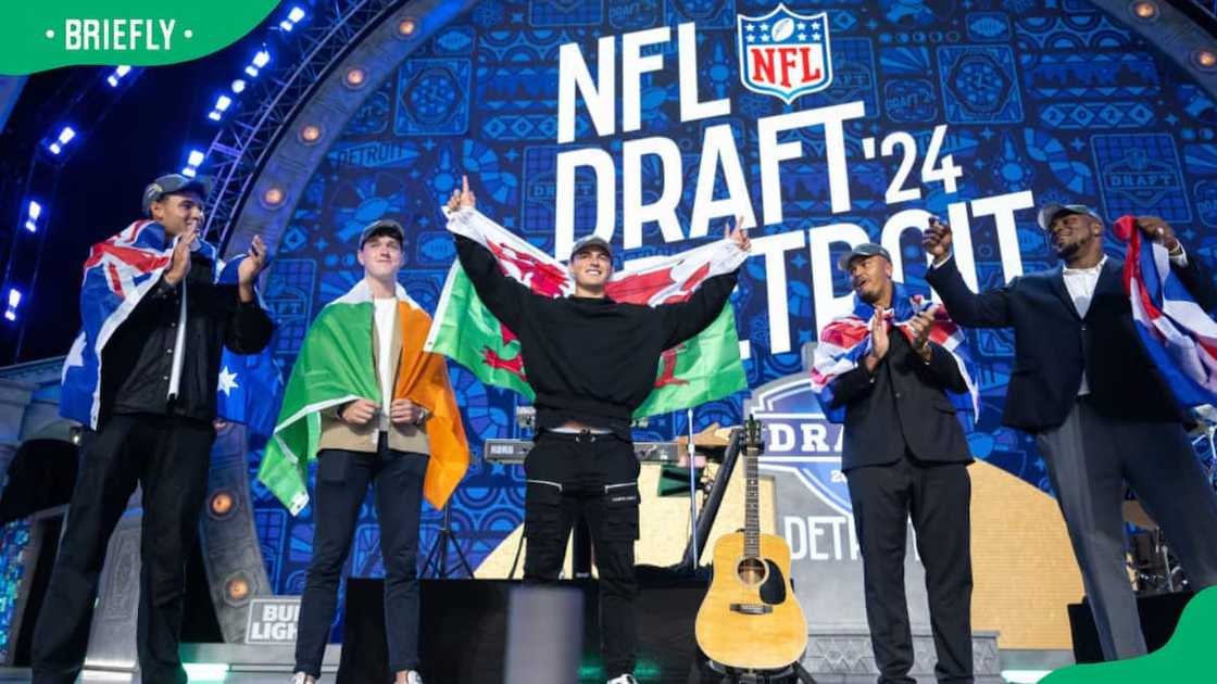 Players recognised on stage during an NFL Draft Players recognised on stage during an NFL Draft