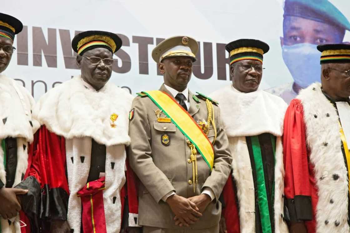Mali's junta chief Colonel Assimi Goita (C) has tied the release of 46 Ivorian troops to the extradition of Malians living in Ivory Coast Mali's junta chief Colonel Assimi Goita (C) has tied the release of 46 Ivorian troops to the extradition of Malians living in Ivory Coast