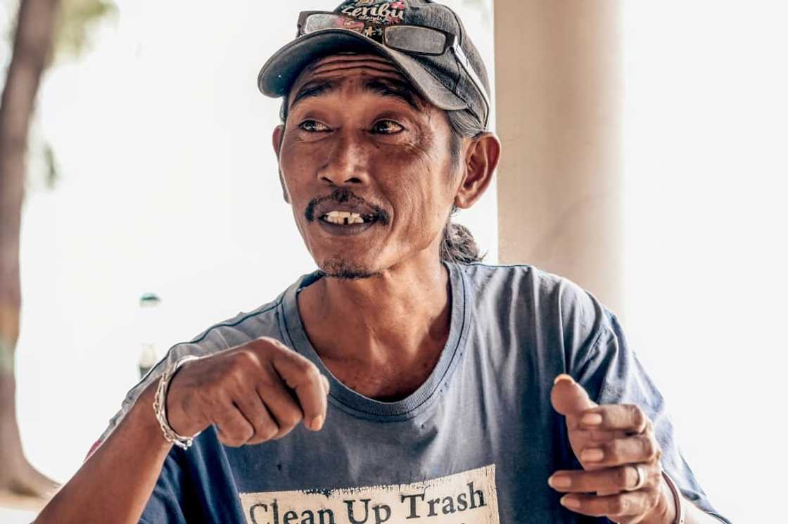 "I live in worry. I fear that when I am asleep, the water will suddenly rise," says Arif Pujianto "I live in worry. I fear that when I am asleep, the water will suddenly rise," says Arif Pujianto
