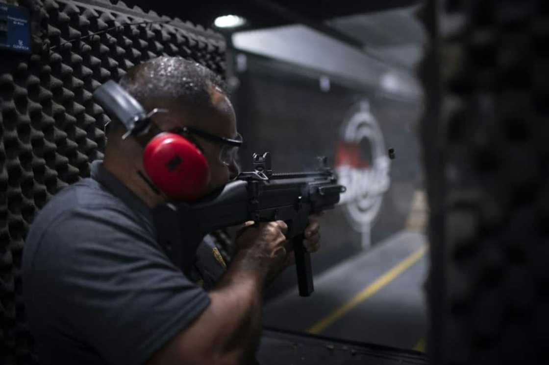 Target practice at the Mil Armas firing range in Nova Iguacu, Rio de Janeiro. Target practice at the Mil Armas firing range in Nova Iguacu, Rio de Janeiro.