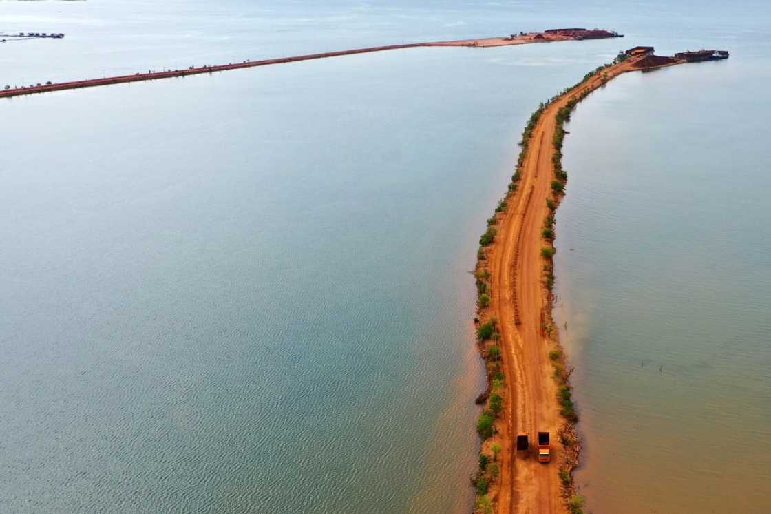 Trucks transport soil containing nickel ore in Pomalaa in southeast Sulawesi