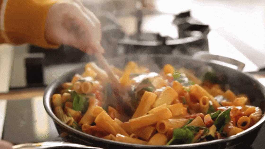 Preparing veggie pasta bake