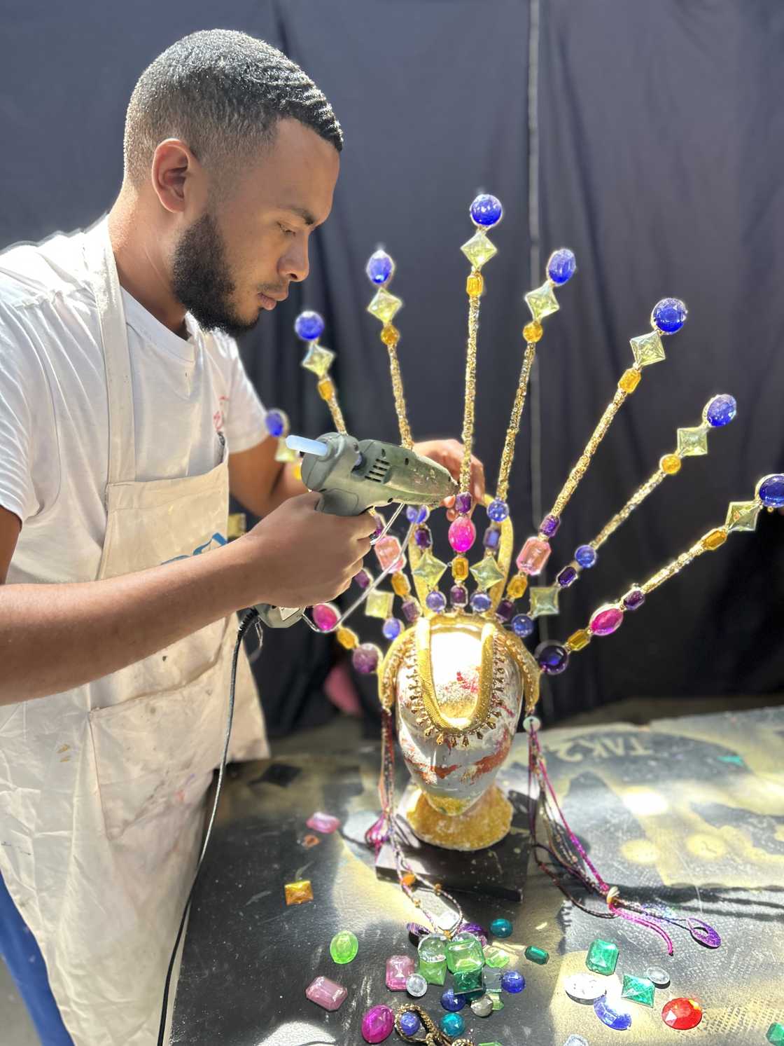 Ebrahim Dollie creates a headpiece for the Cape Town Carnival.