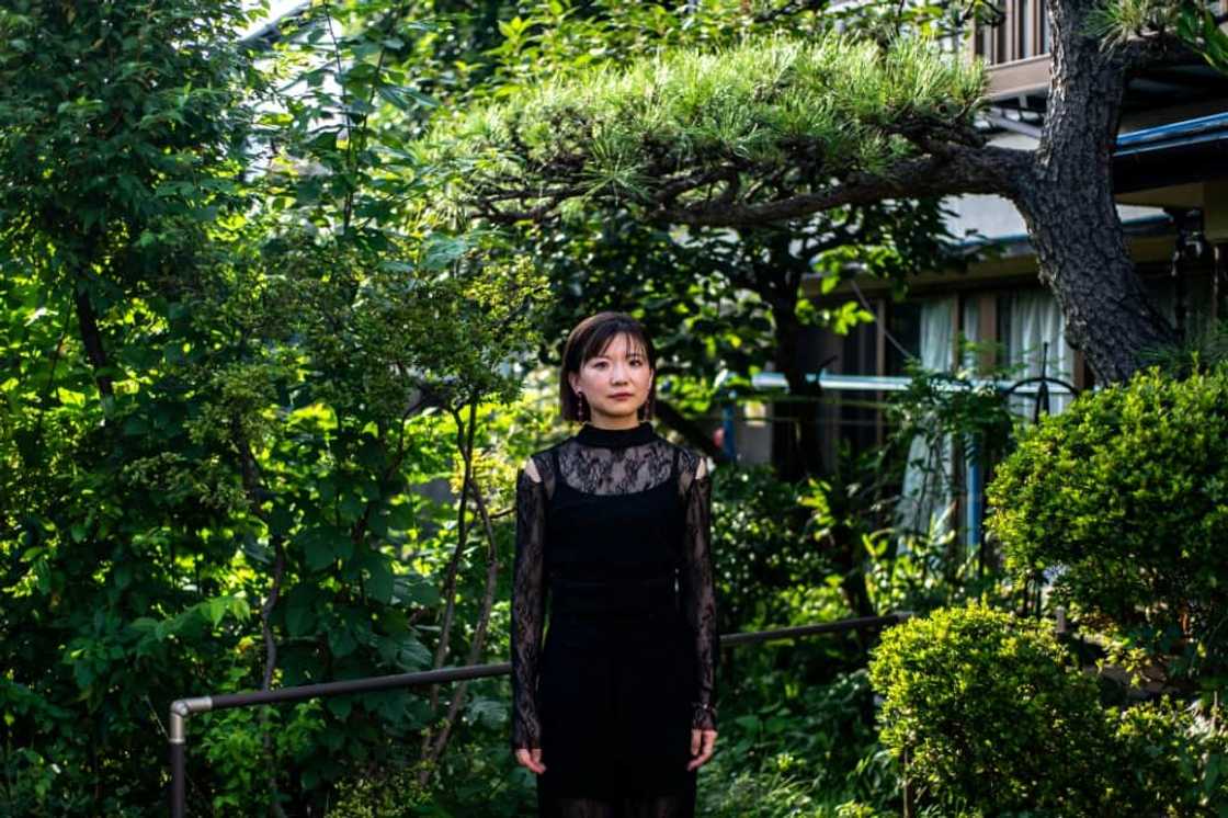 Aya Takeshima's recent show at Tokyo Fashion Week for her brand Ayame featured women wearing sheer blouses and men in delicate dresses Aya Takeshima's recent show at Tokyo Fashion Week for her brand Ayame featured women wearing sheer blouses and men in delicate dresses