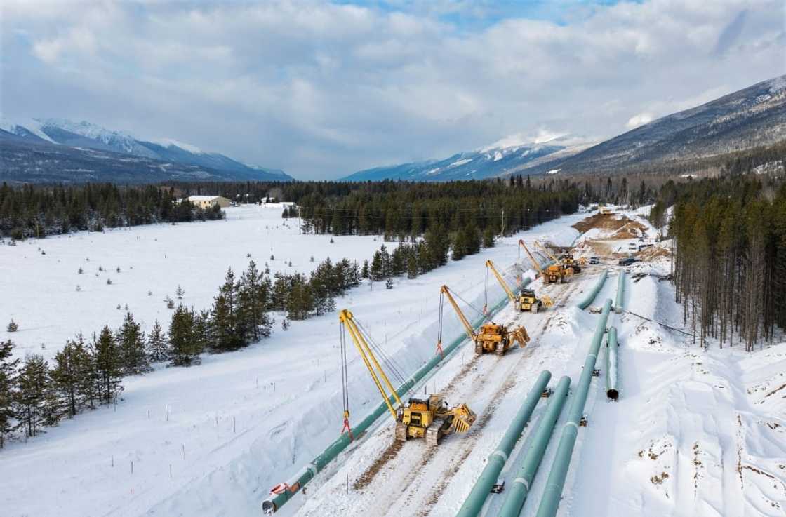 This December 9, 2021, image courtesy of Trans Mountain Corporation shows winter pipeline construction work in Valemount, British Columbia, Canada. The first major new pipeline to be built in Canada in decades is set to open on May 1 This December 9, 2021, image courtesy of Trans Mountain Corporation shows winter pipeline construction work in Valemount, British Columbia, Canada. The first major new pipeline to be built in Canada in decades is set to open on May 1