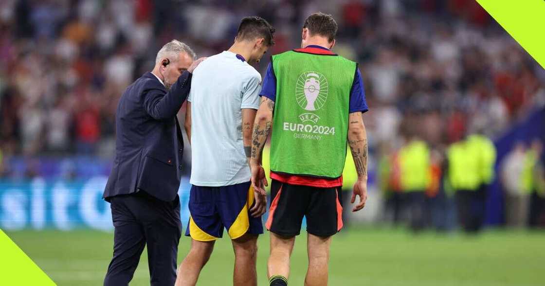 A security guard collides with Alvaro Morata during Spain’s celebration against France A security guard collides with Alvaro Morata during Spain’s celebration against France