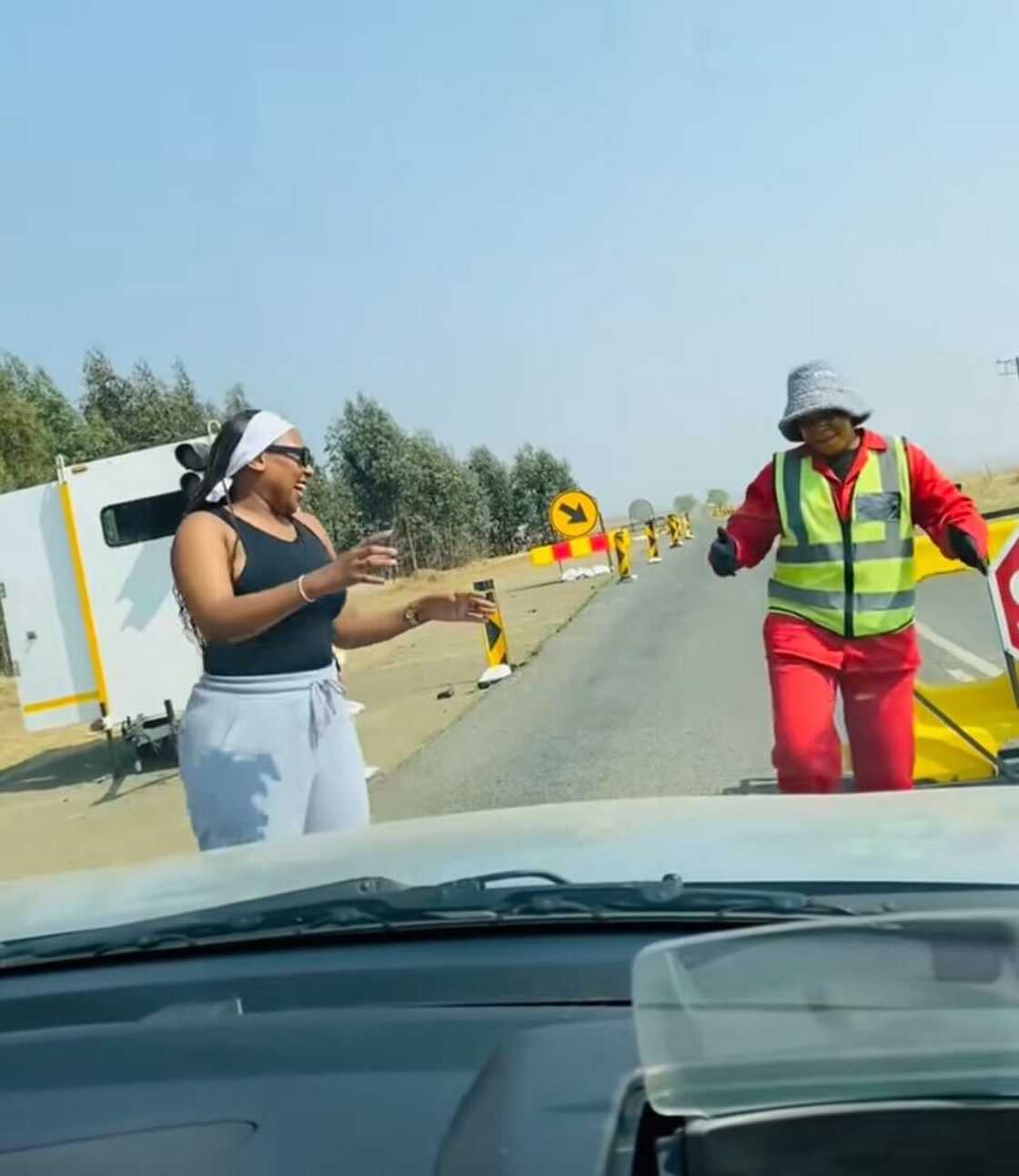 A roadworker and a woman’s joyful dance moved hearts and went viral online. A roadworker and a woman’s joyful dance moved hearts and went viral online.