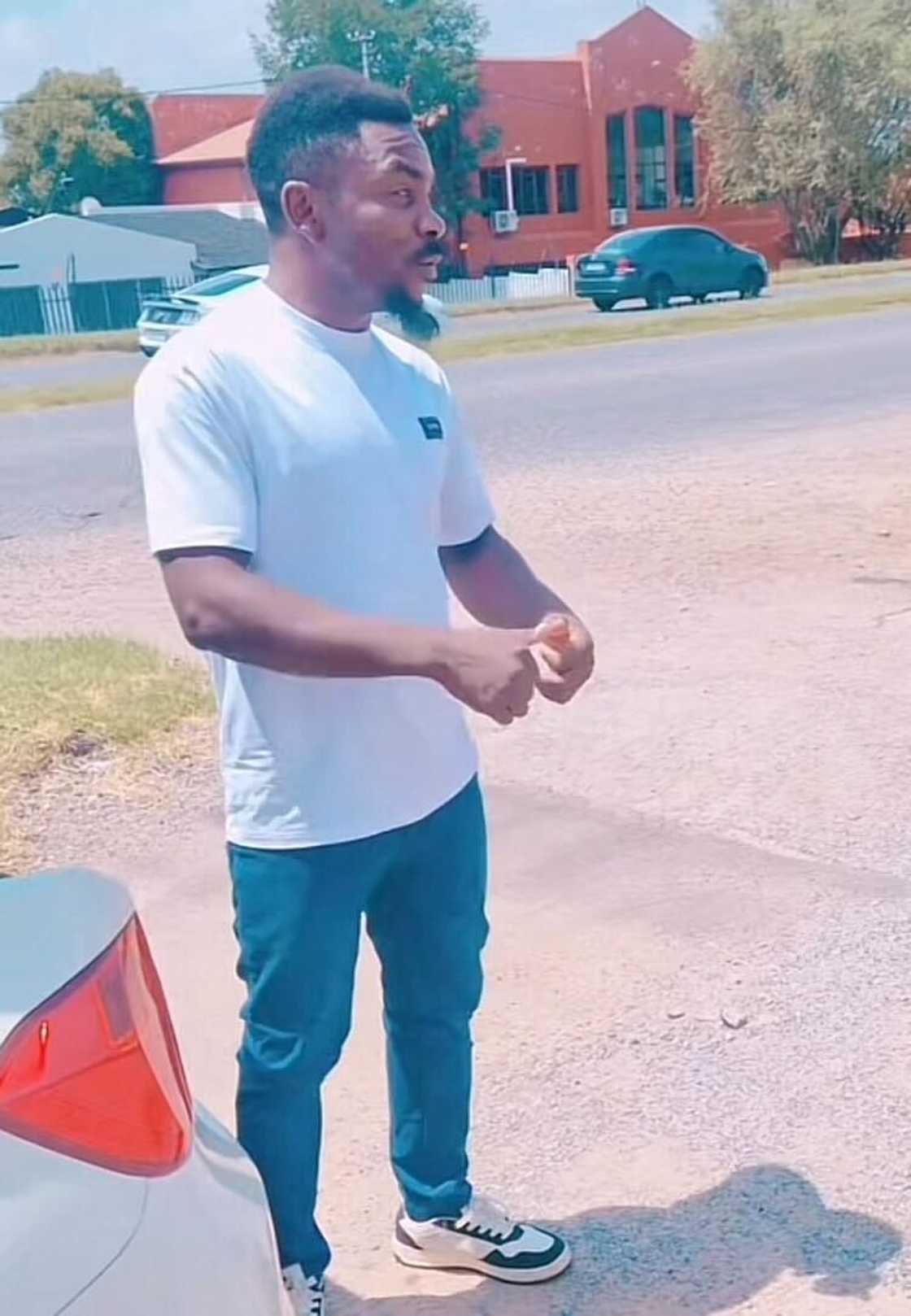 A man served strangers food from the back of his car trunk, which touched many. A man served strangers food from the back of his car trunk, which touched many.