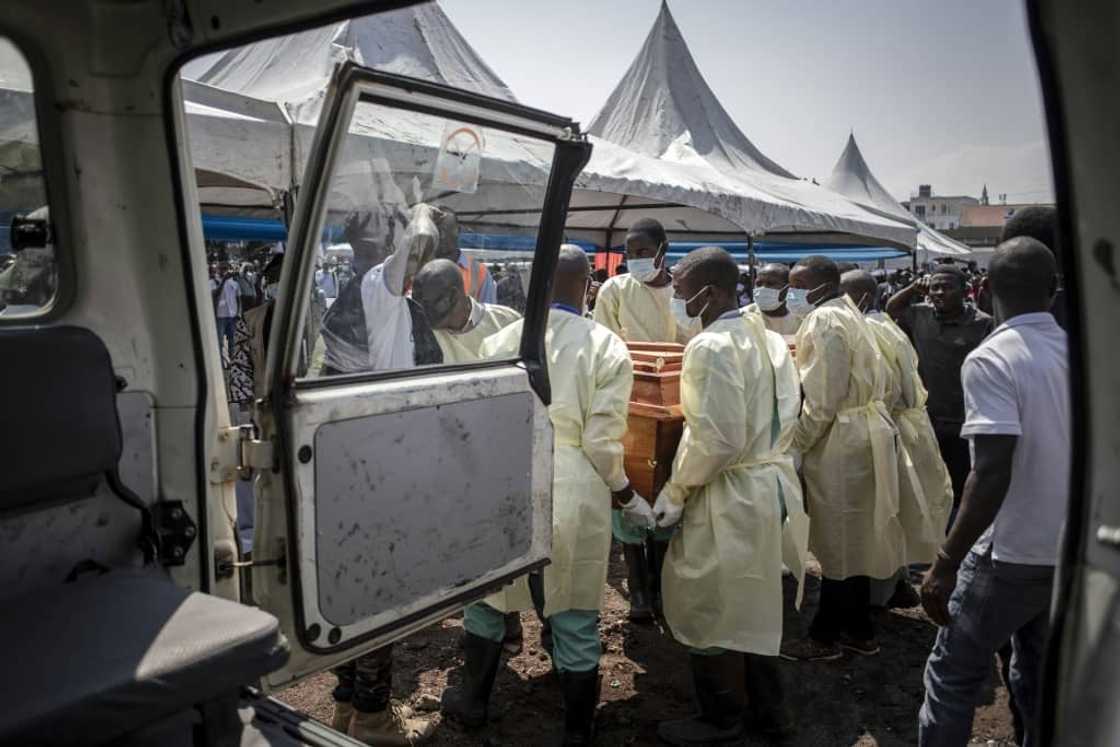 Health workers carry the coffin of an activist killed during a demonstration against UN peacekeepers last week