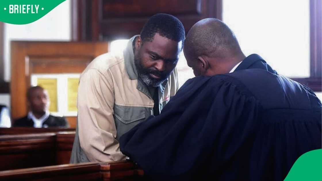 Victor Majola speaking to his lawyer, Advocate Dumisani Mabunda