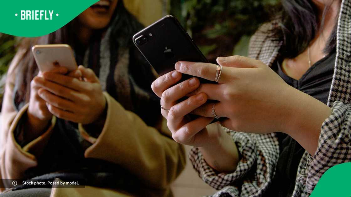 People laughing at their phones.