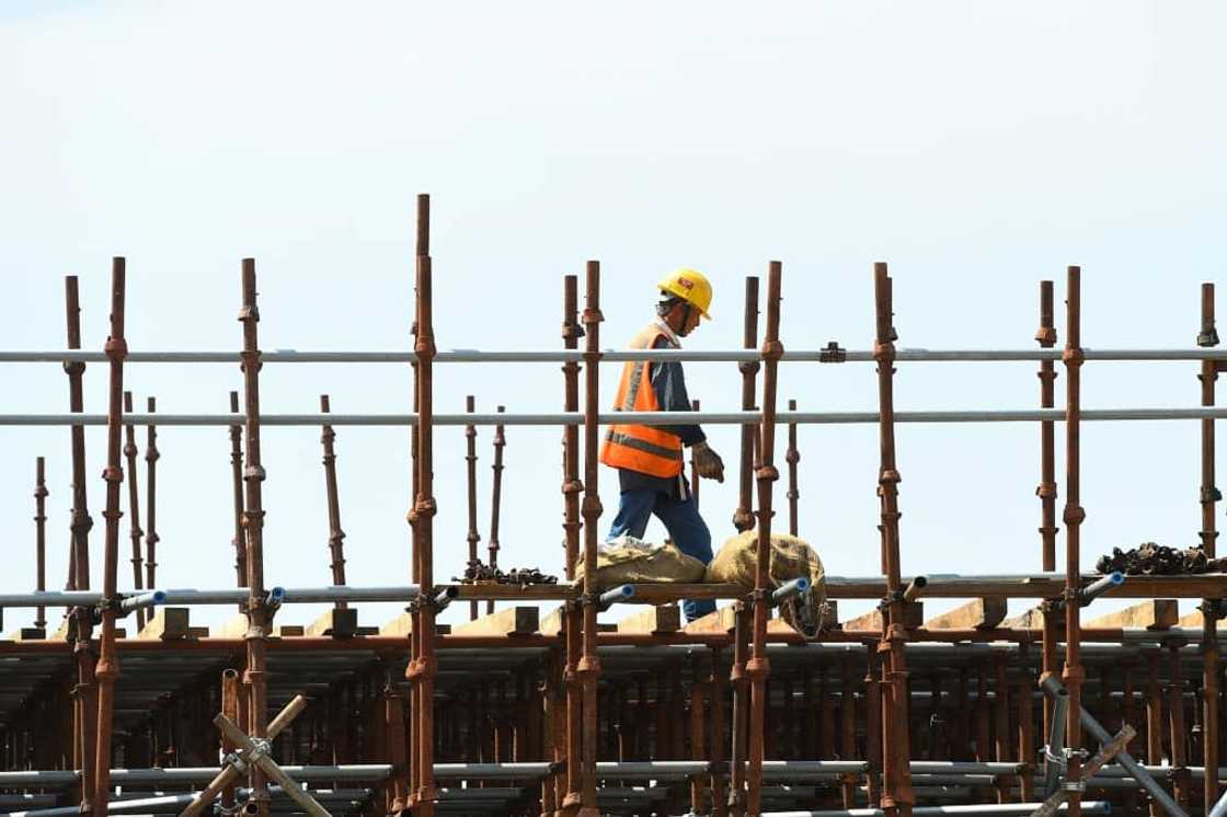 A Chinese laborer works at a construction site on reclaimed land in February 2020, part of a Chinese-funded project in Colombo, Sri Lanka A Chinese laborer works at a construction site on reclaimed land in February 2020, part of a Chinese-funded project in Colombo, Sri Lanka