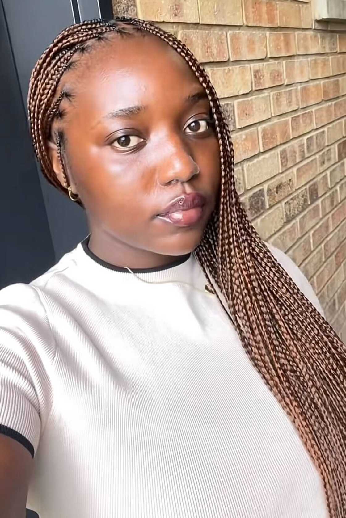 A young South African woman posted a TikTok video as she created content.