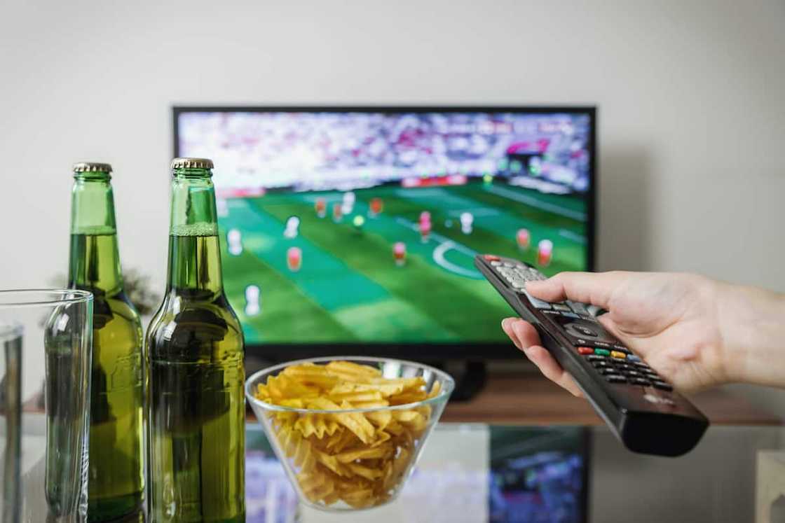 A person watching a sports game A person watching a sports game